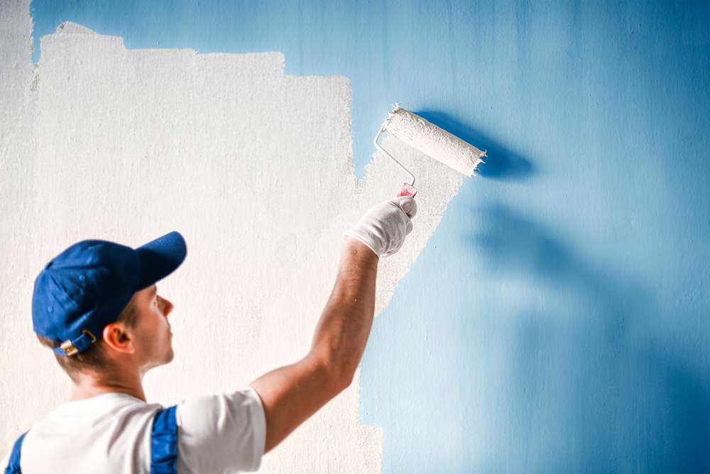 A M8 painting a wall blue